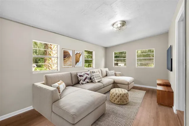 a living room with furniture and a window