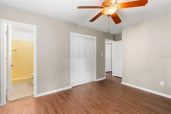 a view of room with wooden floor