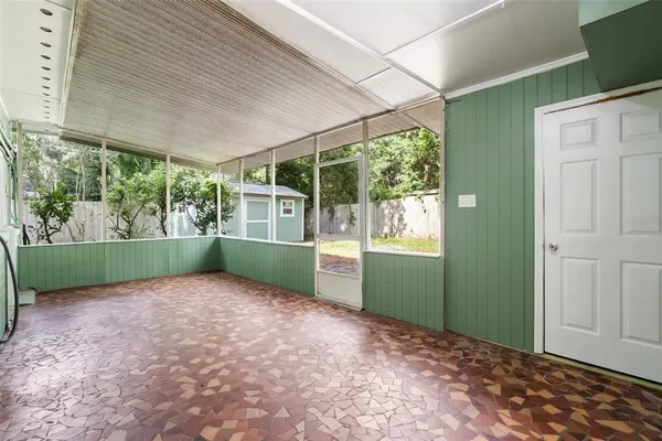 an empty room with a window and outdoor view
