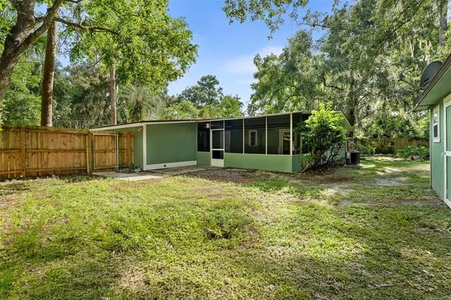 a backyard of a house with lots of green space