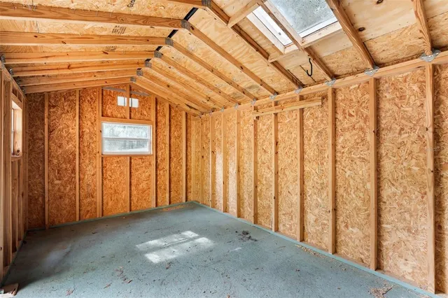 a view of a room with wooden walls
