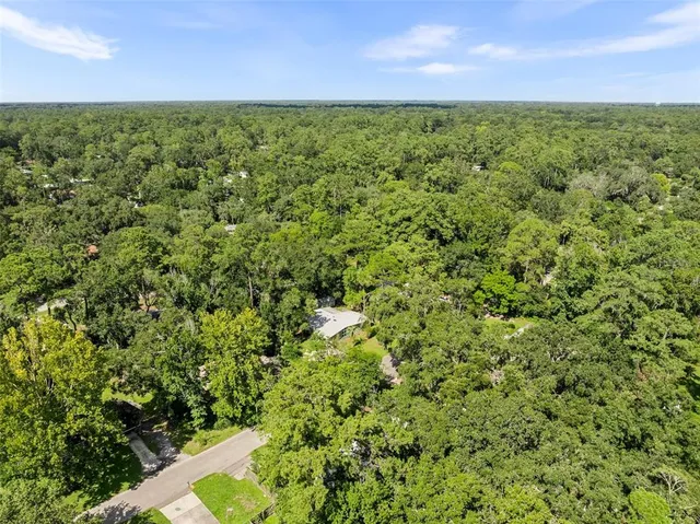 a view of a yard with an outdoor space