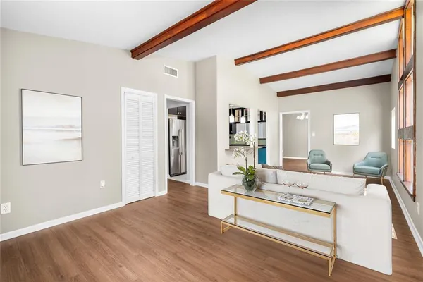 a living room with furniture and a table