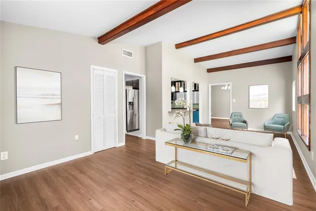 a living room with furniture and a table