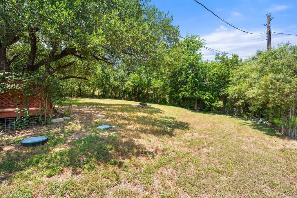 5208 Sioux Lane Austin, TX 78734 - Photo 30 of 35 Mature trees and abundant greenery define this spacious, naturally illuminated outdoor area.