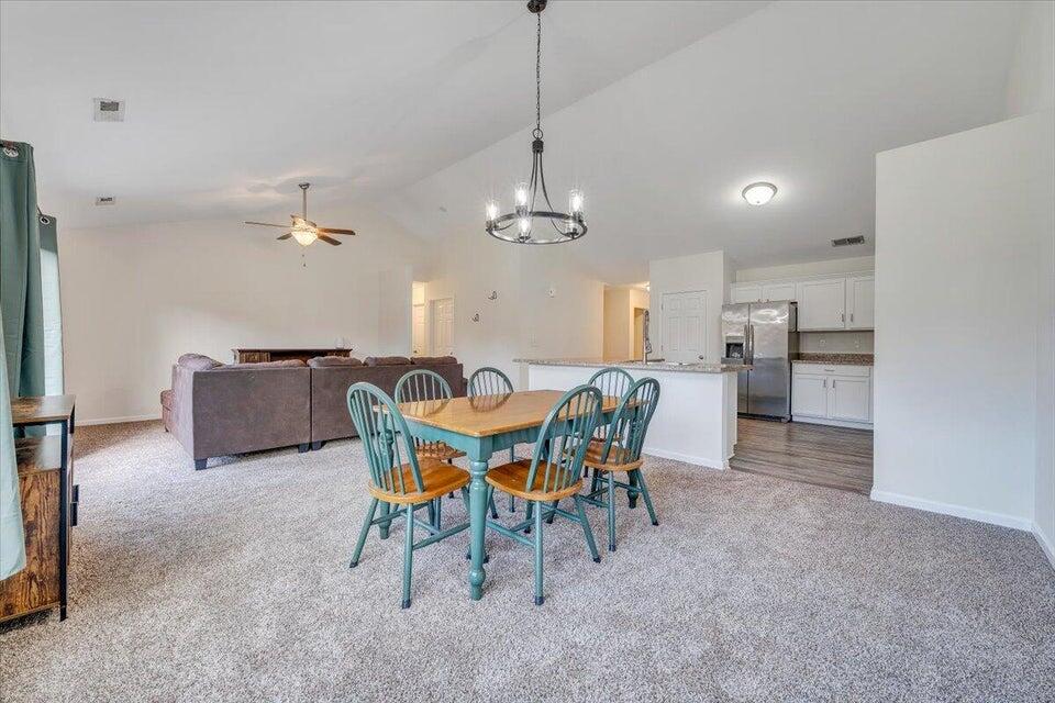 375 Kemp Ford Road Union Hall, VA 24176 - Photo 3 of 7 a view of a dining room with furniture and chandelier