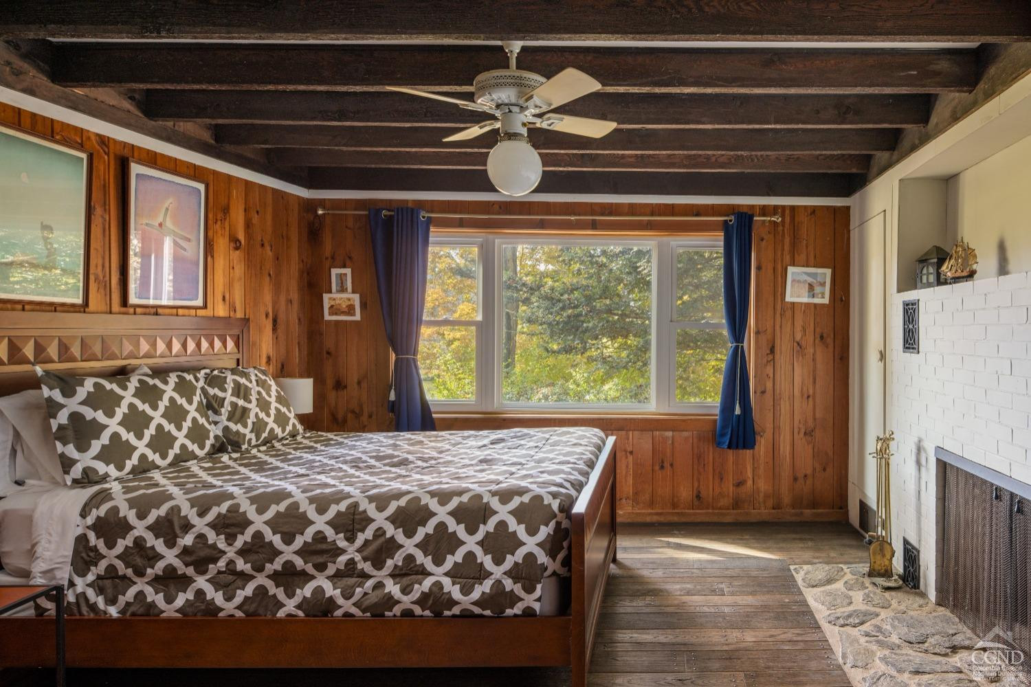 98 Goetz Road East Chatham, NY 12060 - Photo 12 of 28 a bedroom with a large bed and a chandelier