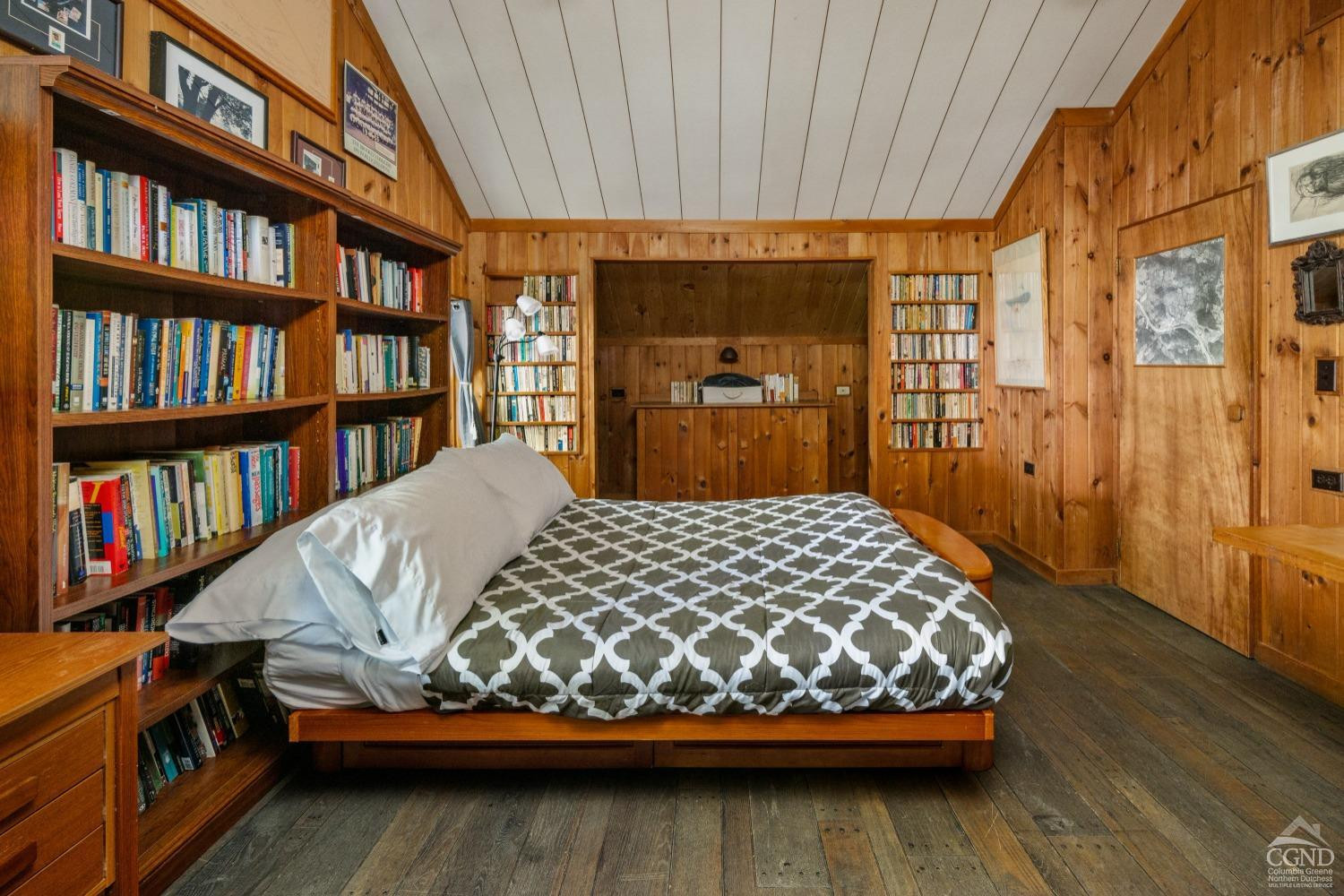 98 Goetz Road East Chatham, NY 12060 - Photo 17 of 28 a bedroom with a bed and a book shelf