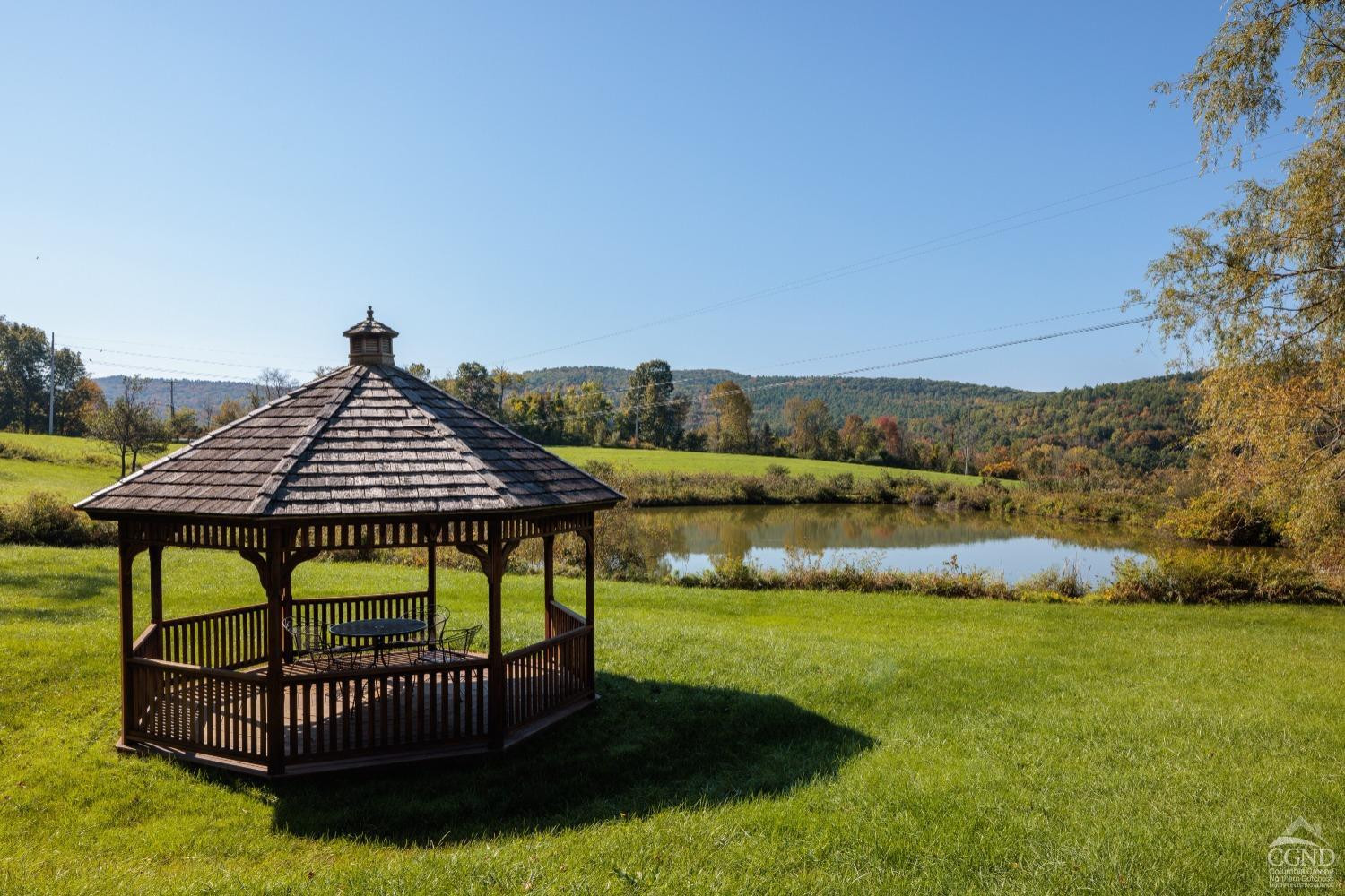98 Goetz Road East Chatham, NY 12060 - Photo 25 of 28 a backyard of a house with table and chairs
