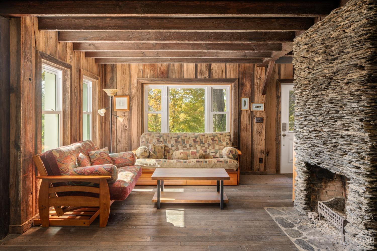 98 Goetz Road East Chatham, NY 12060 - Photo 3 of 28 a living room with furniture and a fireplace