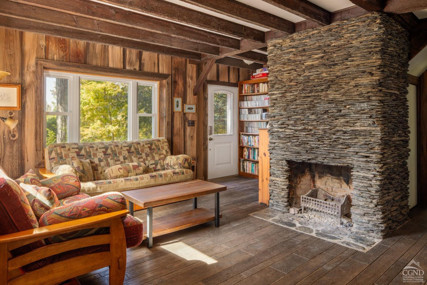 98 Goetz Road East Chatham, NY 12060 - Photo 9 of 28 a living room with furniture and a fireplace