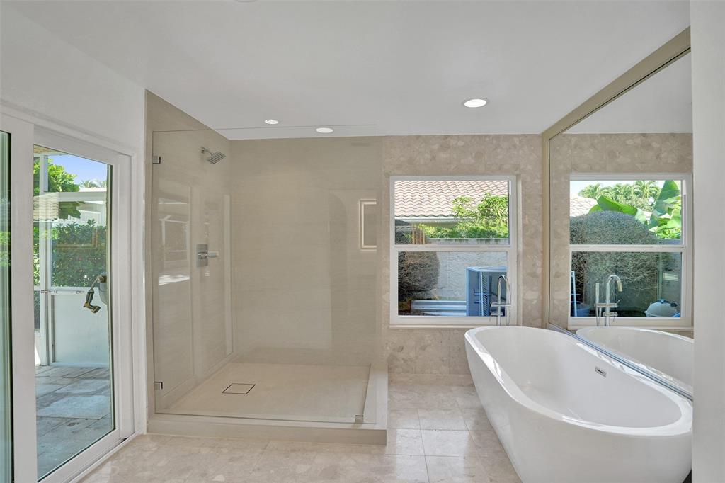 2891 Northwest 28th Terrace Boca Raton, FL 33434 - Photo 27 of 51 a bathroom with a bathtub and shower