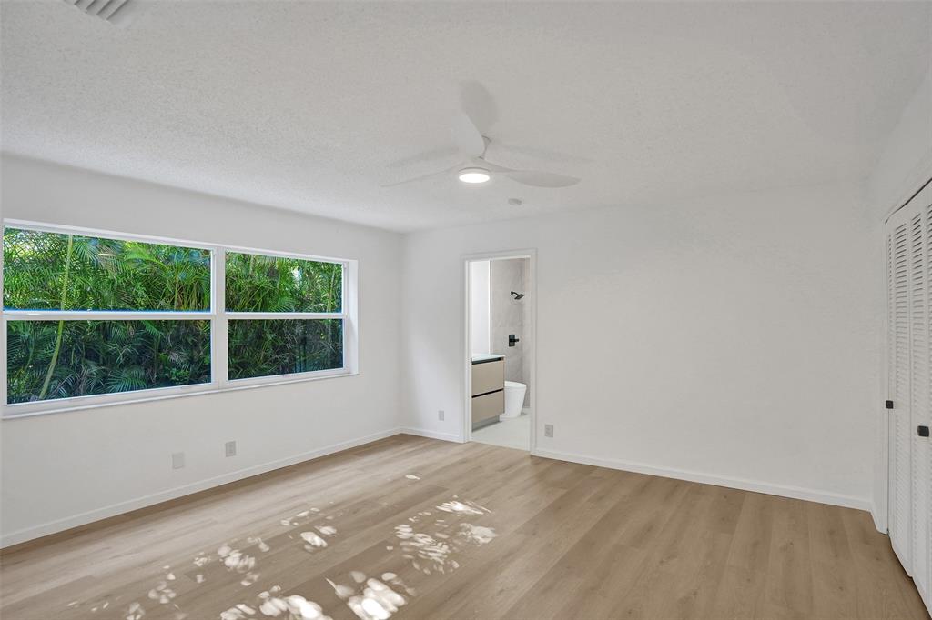 2891 Northwest 28th Terrace Boca Raton, FL 33434 - Photo 39 of 51 a view of an empty room with a window