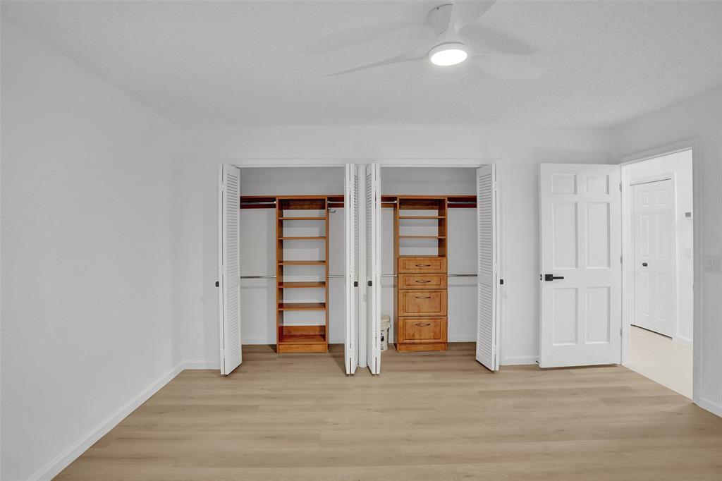 2891 Northwest 28th Terrace Boca Raton, FL 33434 - Photo 41 of 51 wooden floor and closet in a room