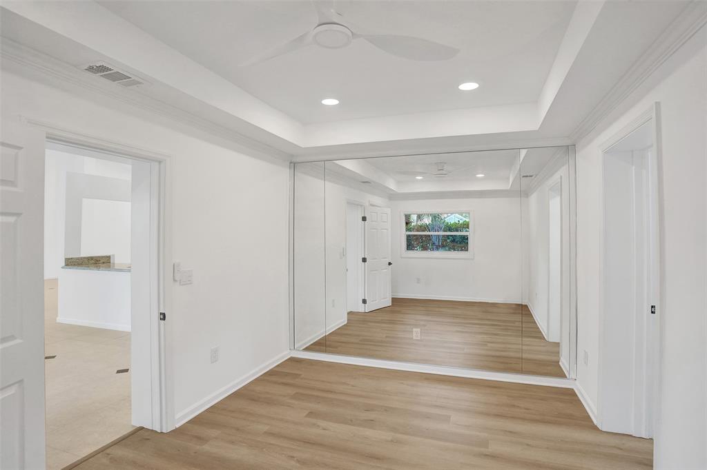 2891 Northwest 28th Terrace Boca Raton, FL 33434 - Photo 44 of 51 a view of a big room with wooden floor and windows