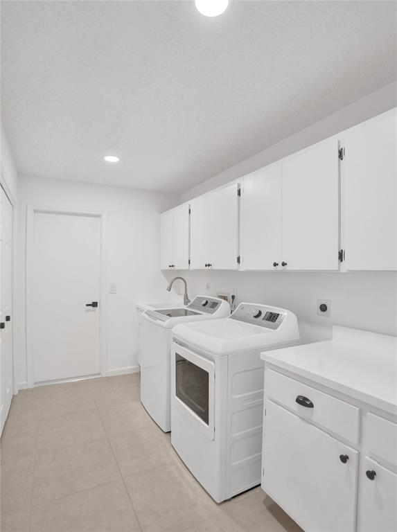 2891 Northwest 28th Terrace Boca Raton, FL 33434 - Photo 46 of 51 a kitchen with white cabinets and white appliances