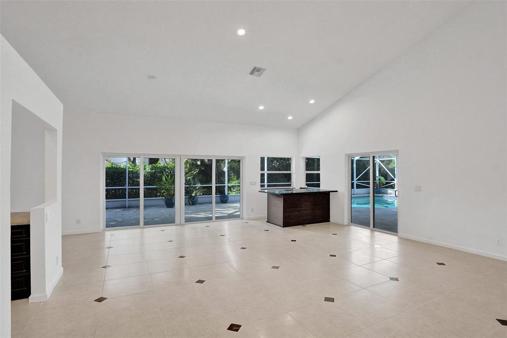 2891 Northwest 28th Terrace Boca Raton, FL 33434 - Photo 6 of 51 an empty room with windows