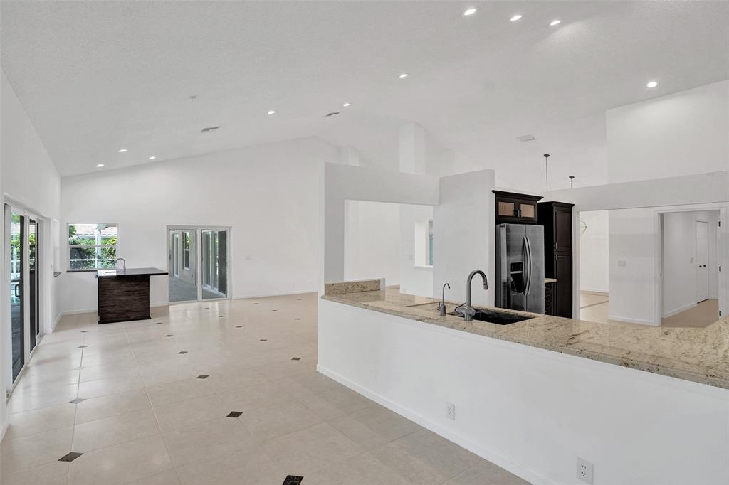 2891 Northwest 28th Terrace Boca Raton, FL 33434 - Photo 10 of 51 a large white kitchen with a large window