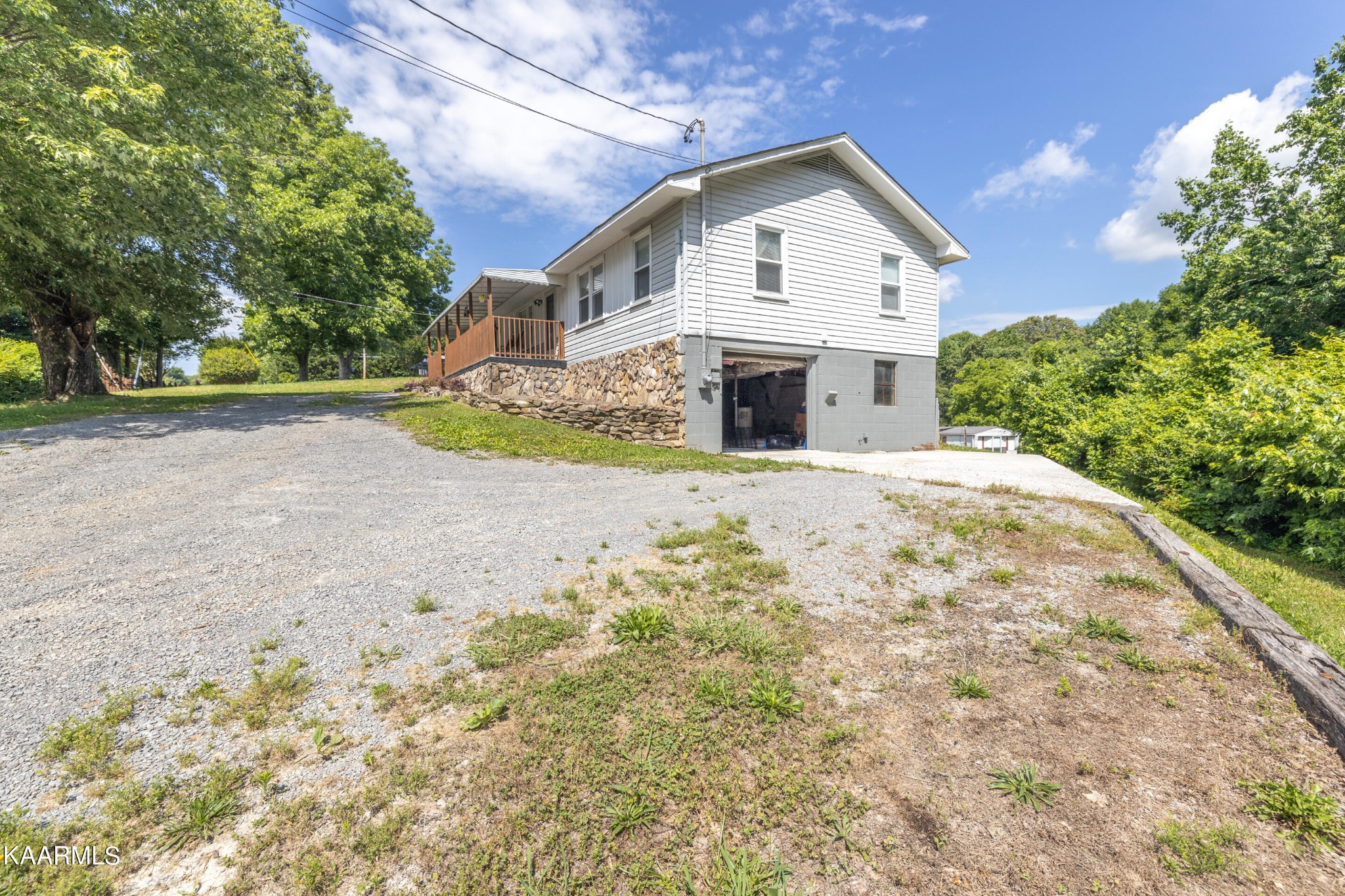 6719 Cate Road Knoxville, TN 37931 - Photo 20 of 30 a front view of a house with a yard and trees