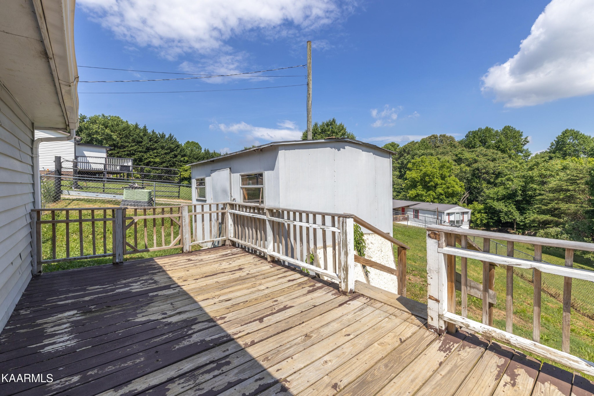 6719 Cate Road Knoxville, TN 37931 - Photo 24 of 30 a view of a wooden deck and a yard