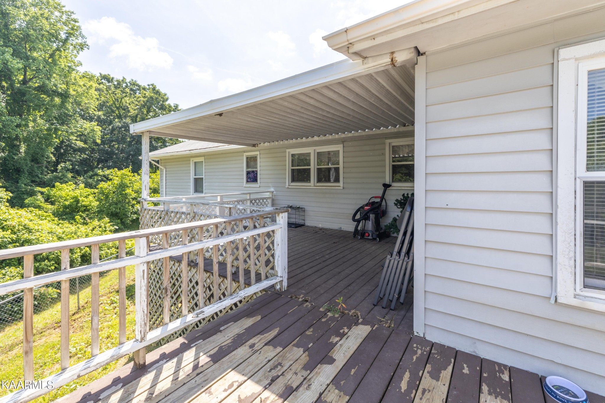 6719 Cate Road Knoxville, TN 37931 - Photo 26 of 30 a view of a house with backyard and deck