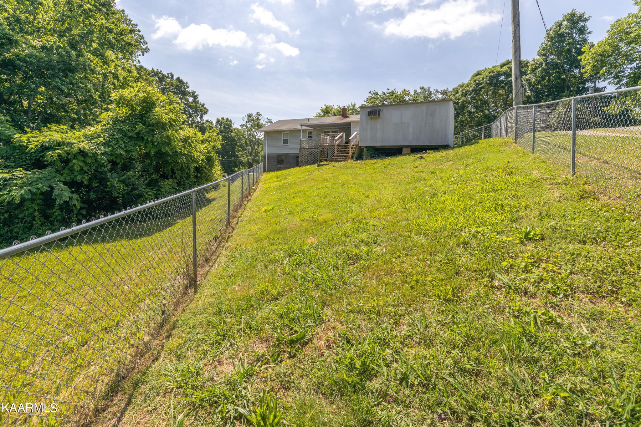6719 Cate Road Knoxville, TN 37931 - Photo 29 of 30 a view of a swimming pool with an outdoor seating and a garden