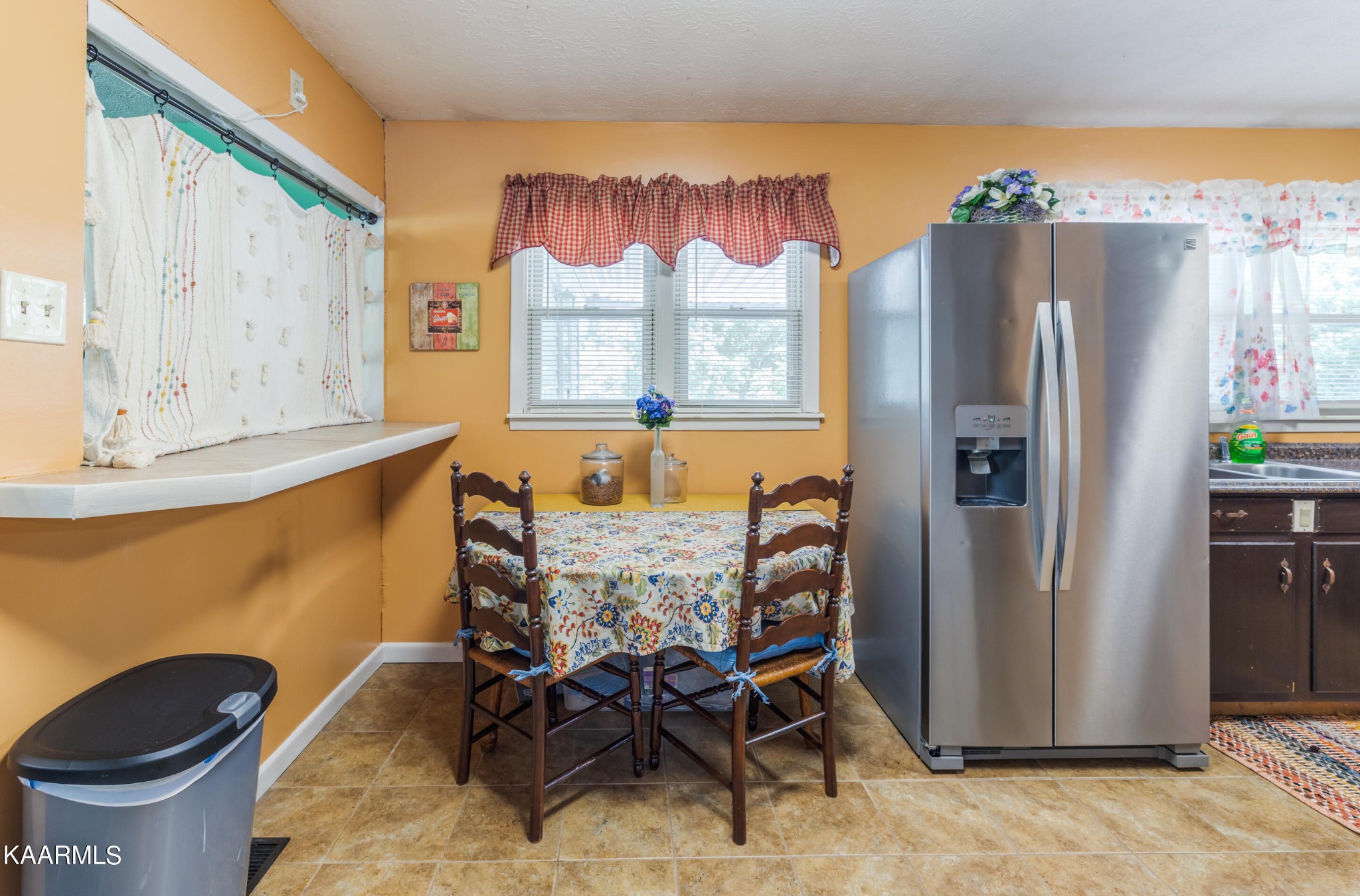 6719 Cate Road Knoxville, TN 37931 - Photo 10 of 30 a kitchen with a refrigerator and a table