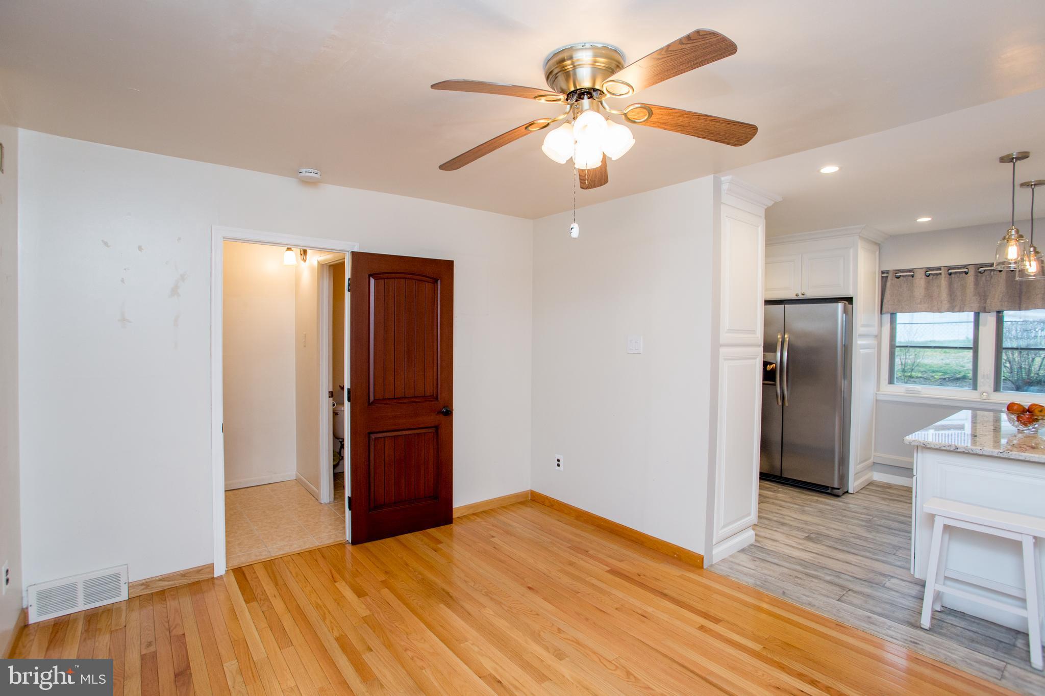 10825 Academy Road Philadelphia, PA 19154 - Photo 13 of 56 Dining Room with view into Powder Room