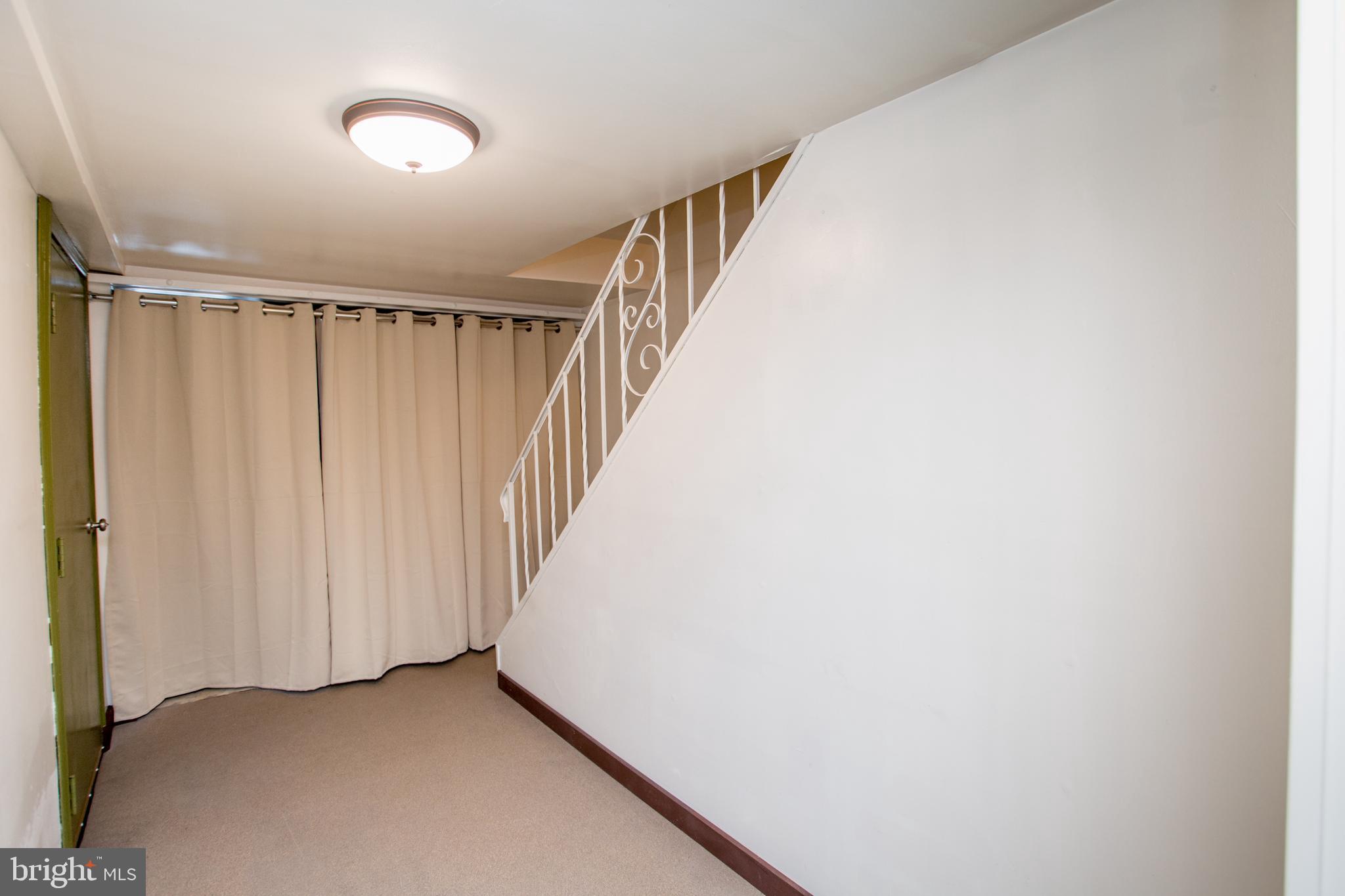 10825 Academy Road Philadelphia, PA 19154 - Photo 47 of 56 Basement with privacy drape to laundry area