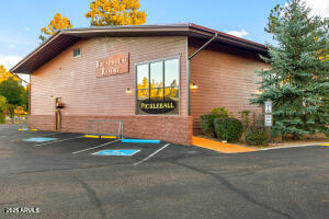 5829 East Buck Springs Road, Unit 252 Pinetop, AZ 85935 - Photo 11 of 27 a front view of a house with yard