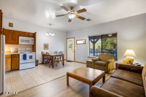 5829 East Buck Springs Road, Unit 252 Pinetop, AZ 85935 - Photo 3 of 27 a living room with furniture and a chandelier