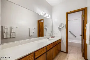 a bathroom with a sink and a mirror