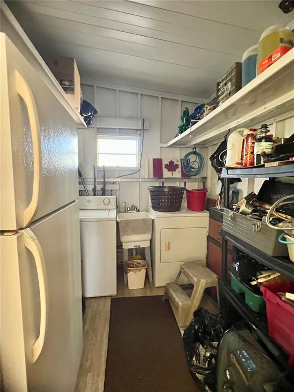 1100 South Belcher Road, Unit 113 Largo, FL 33771 - Photo 14 of 66 a utility room with sink dryer and washer