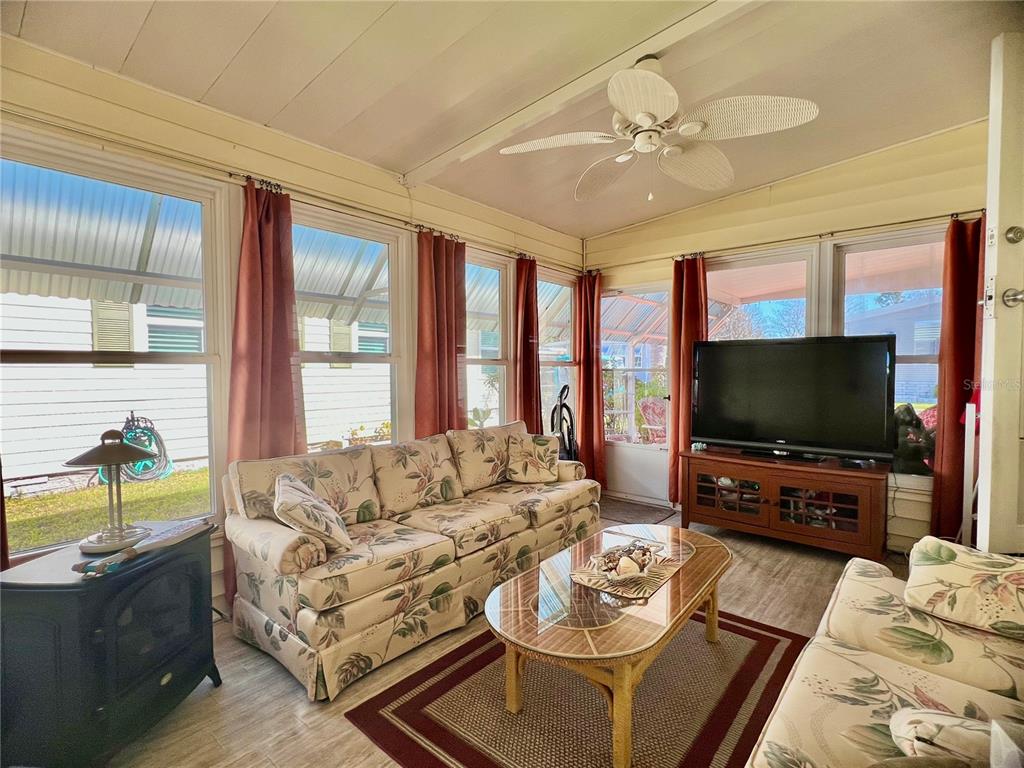 1100 South Belcher Road, Unit 113 Largo, FL 33771 - Photo 15 of 66 a living room with furniture and a flat screen tv