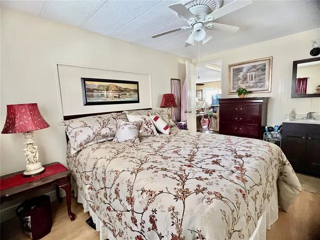 a bedroom with a large bed and a window