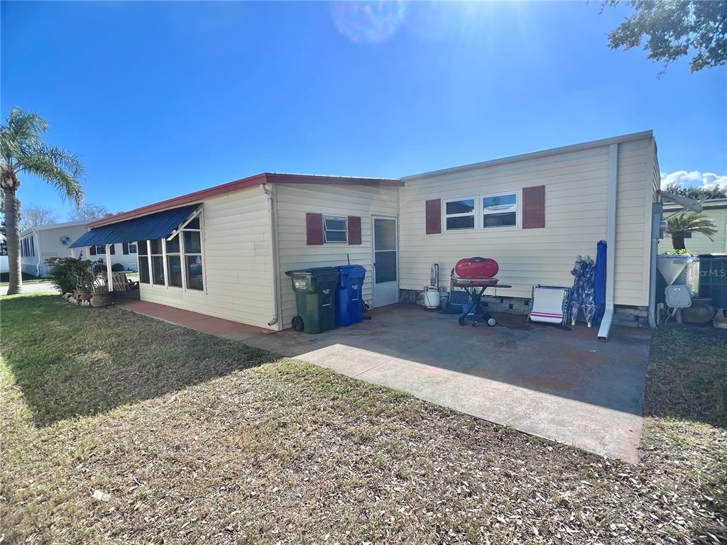 1100 South Belcher Road, Unit 113 Largo, FL 33771 - Photo 9 of 66 a front view of a house with a patio