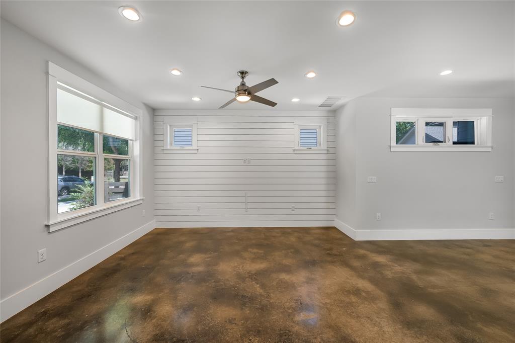 2821 Castro Street, Unit 1 Austin, TX 78702 - Photo 5 of 21 Spacious interior with rich, stained concrete flooring and a modern ceiling fan