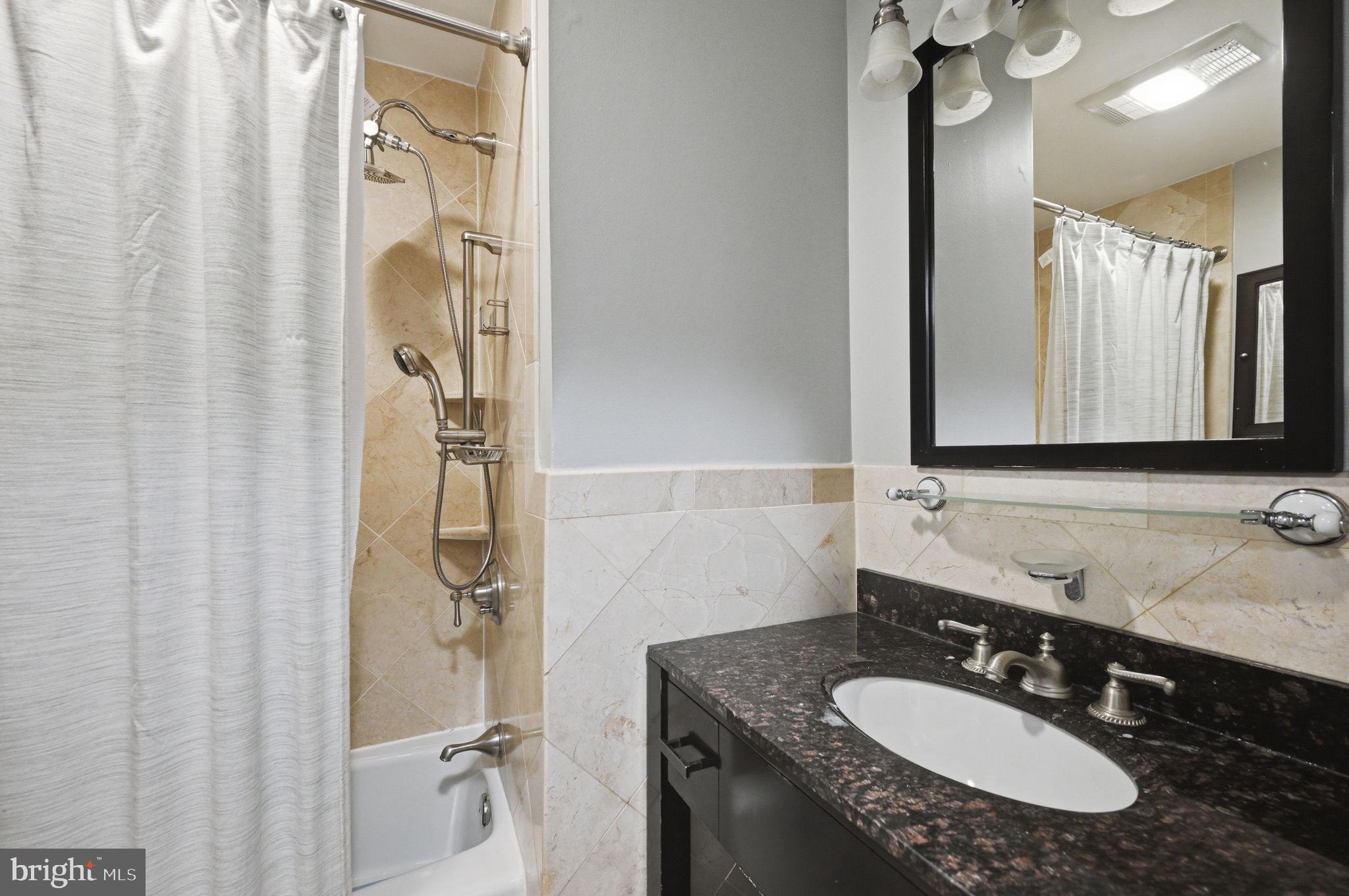 2506 Pinoak Lane Reston, VA 20191 - Photo 13 of 33 a bathroom with a granite countertop sink and a mirror