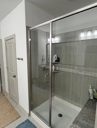 a bathroom with a shower and toilet