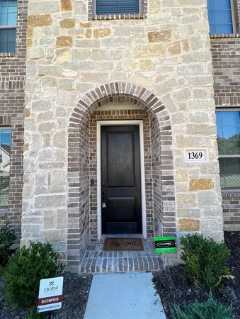 a front view of a building with a door and a shower