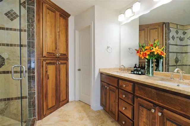 a bathroom with a sink vanity and a mirror