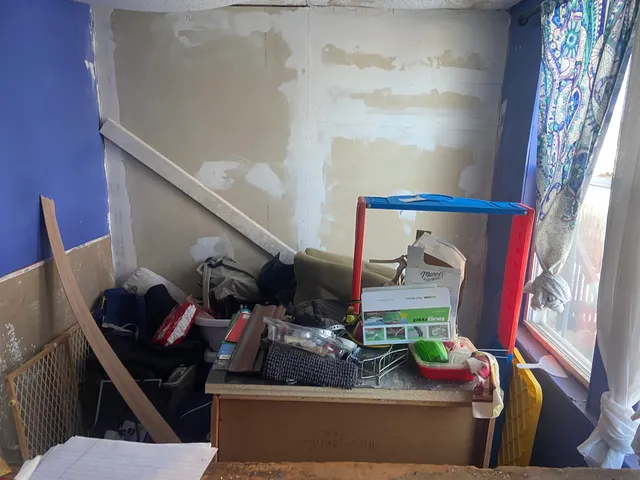a white refrigerator freezer and a stove sitting inside of a kitchen