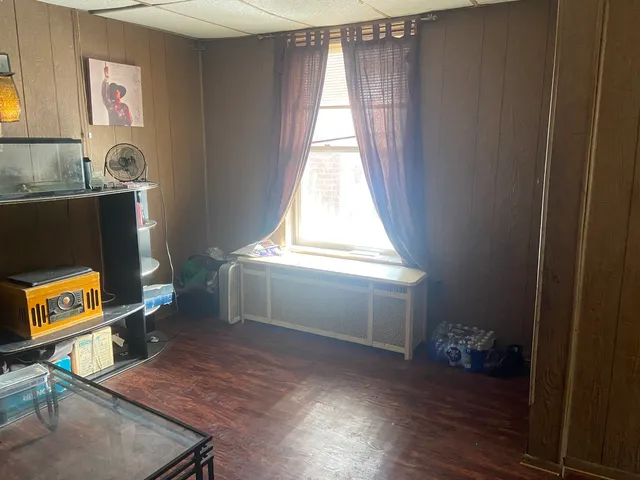 a view of a livingroom with furniture and staircase