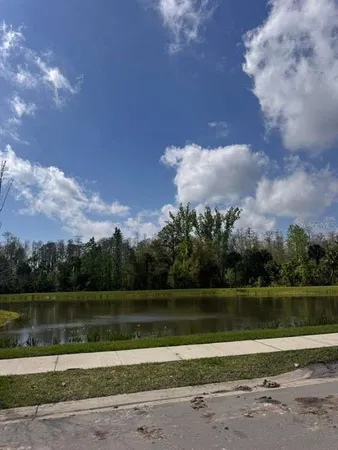 a view of a lake in between two of buildings