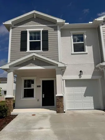a front view of a house with garage