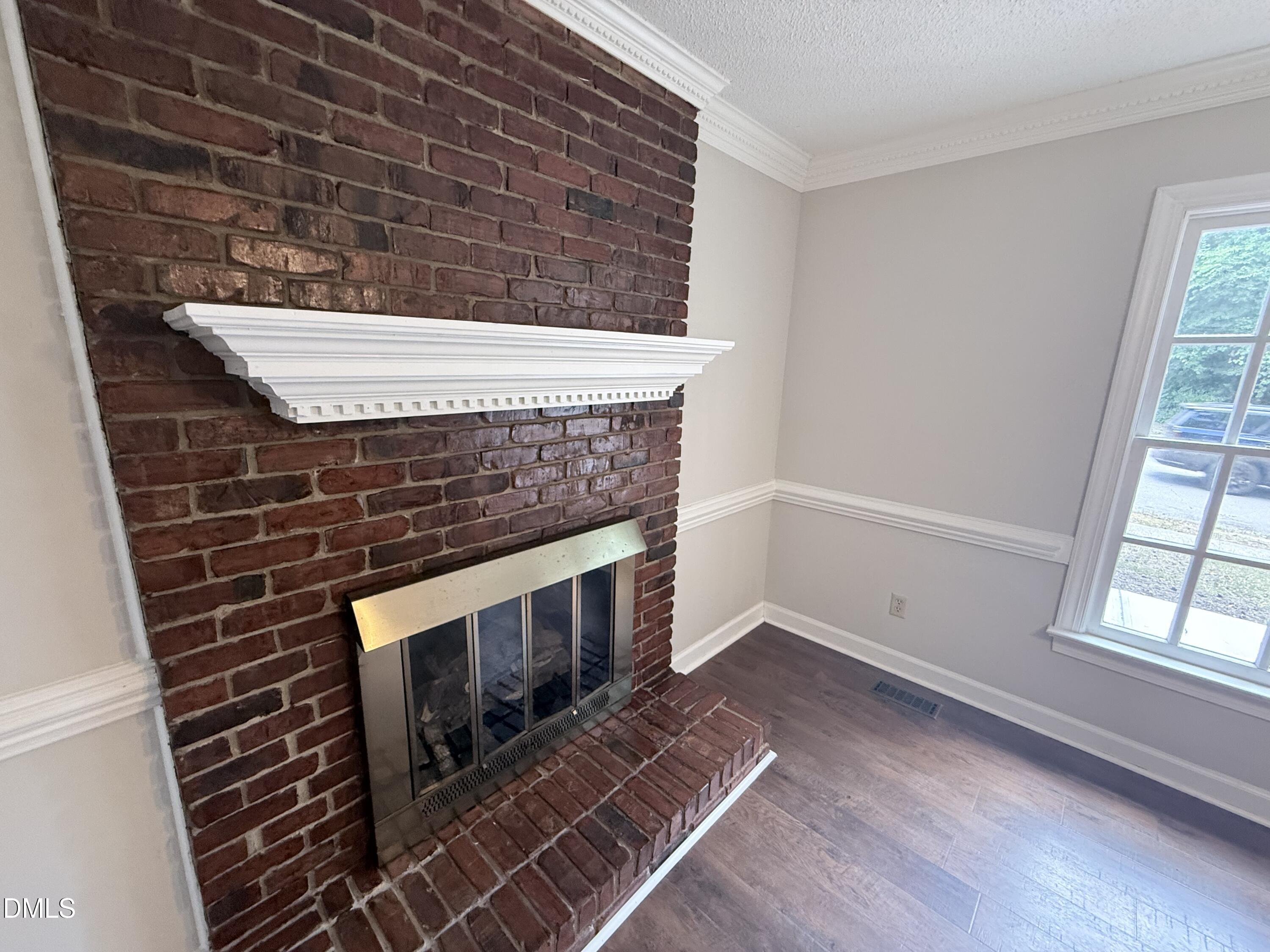 2900 Broadlands Drive Raleigh, NC 27604 - Photo 25 of 60 a view of an empty room with wooden floor and a window