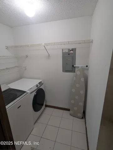 a view of a room with furniture and balcony