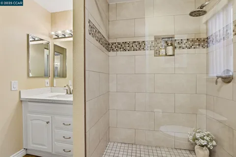 a bathroom with a sink a toilet and shower curtain