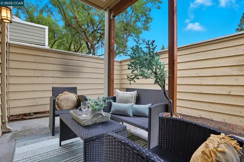 a outdoor living space with furniture and a potted plant