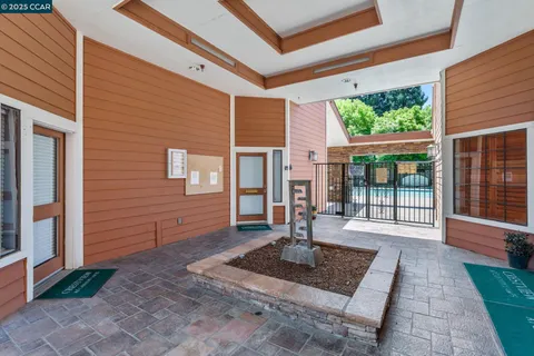 a view of a swimming pool with a patio